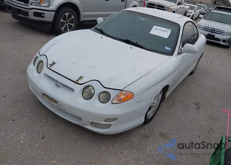 2000 Hyundai Tiburon Base Pkg 1, 2 5/Base Pkg 3 4 z USA, uszkodzony, nr VIN KMHJG35F6YU167638